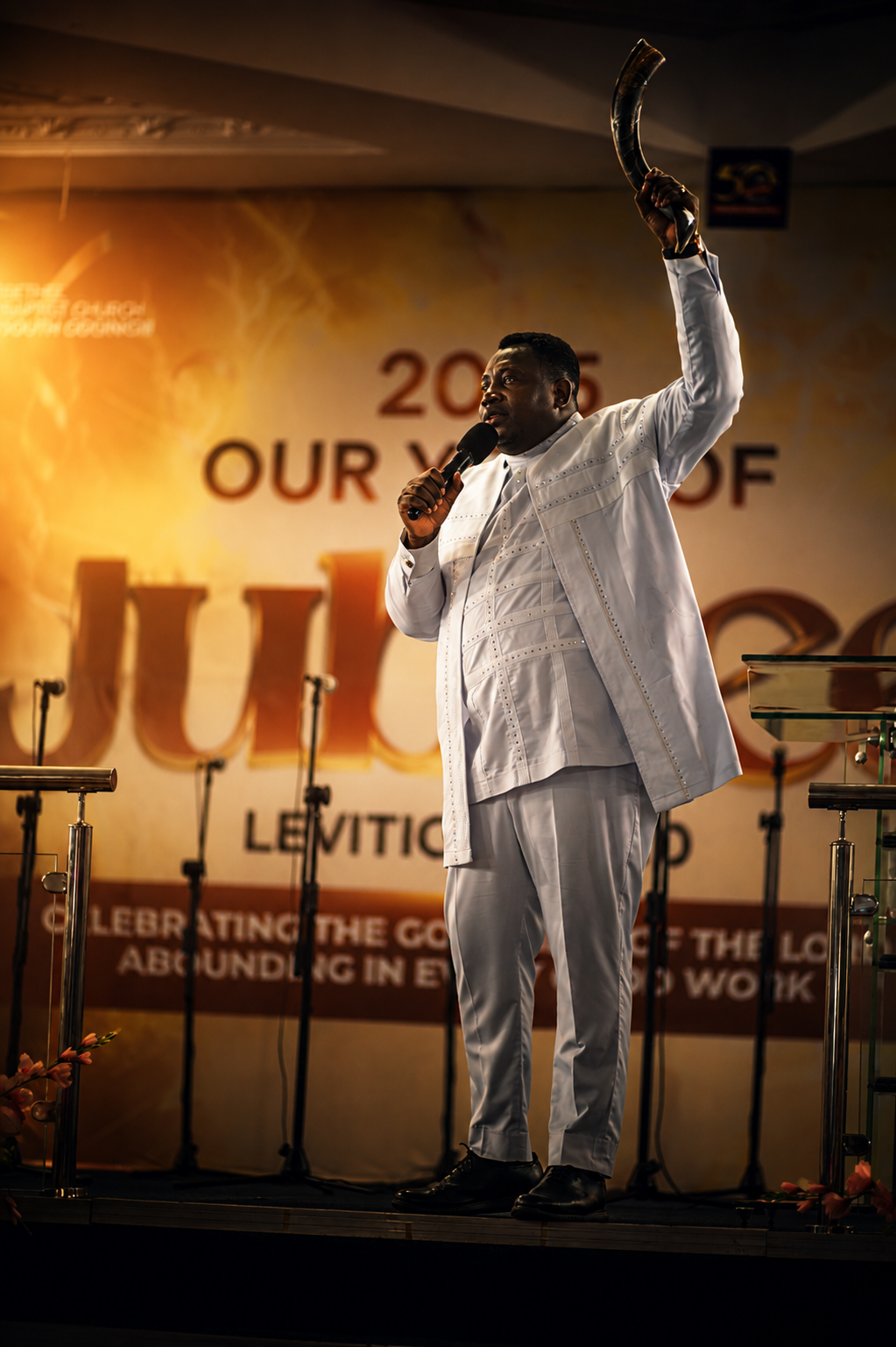 Rev. Gabriel Sekyi-Yorke ministering with a shofar raised