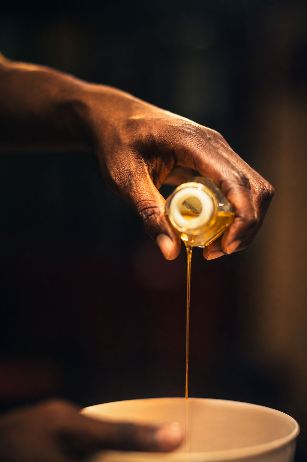 Anointing oil being poured for prayer